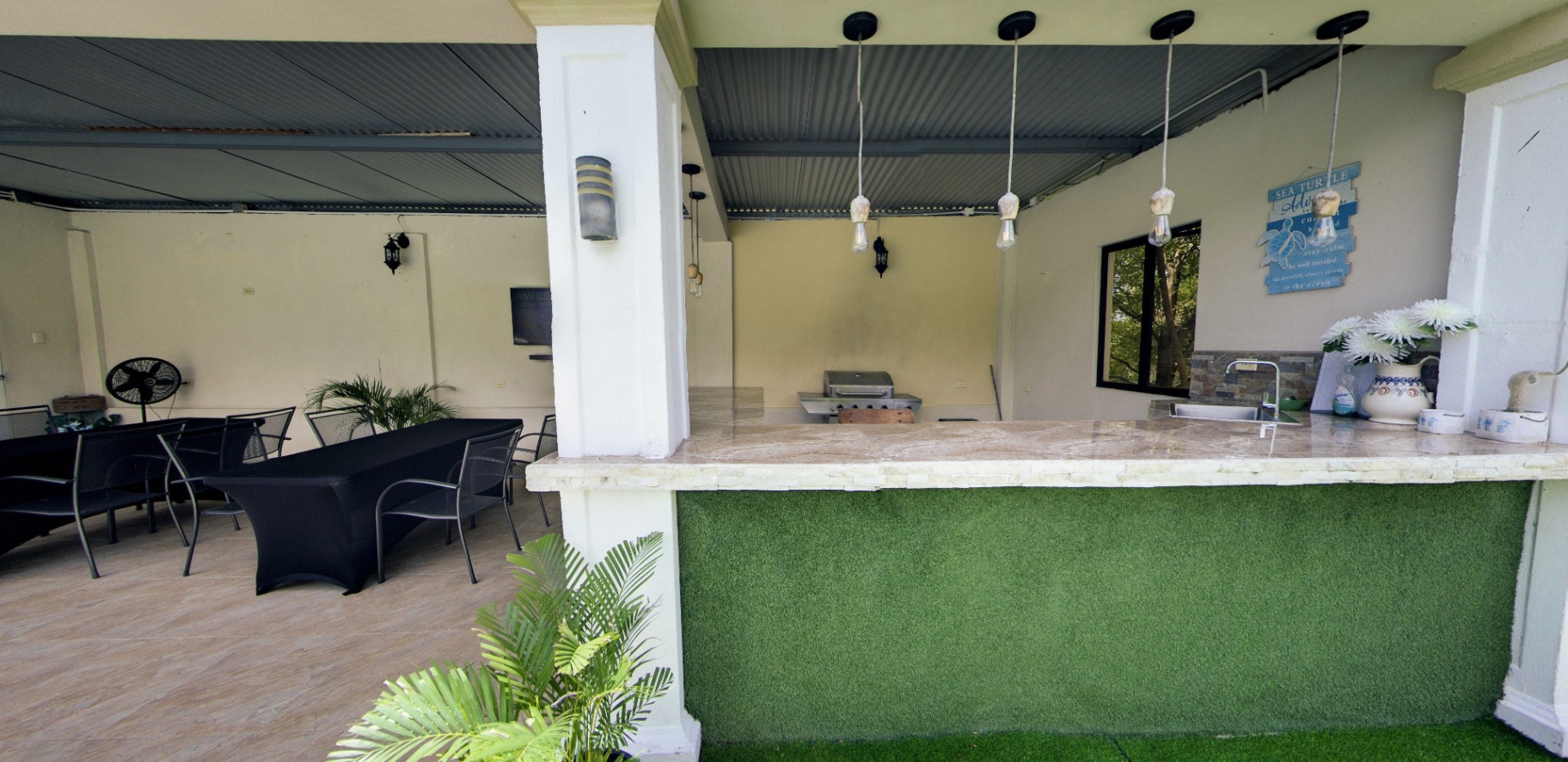 Covered cabana with bar, grill and dining table