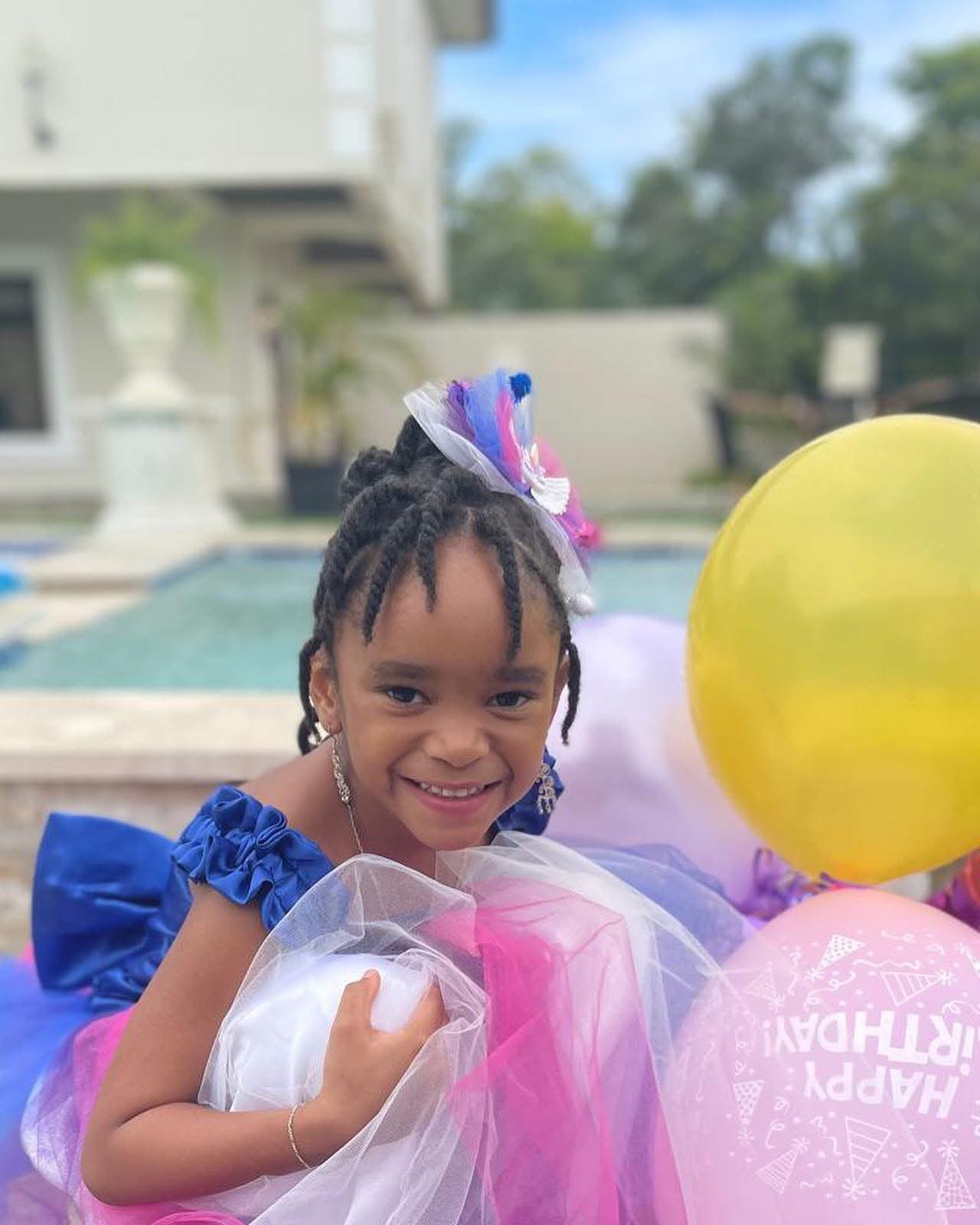Child celebrating a poolside birthday party at Vintage Oaks Hideaway