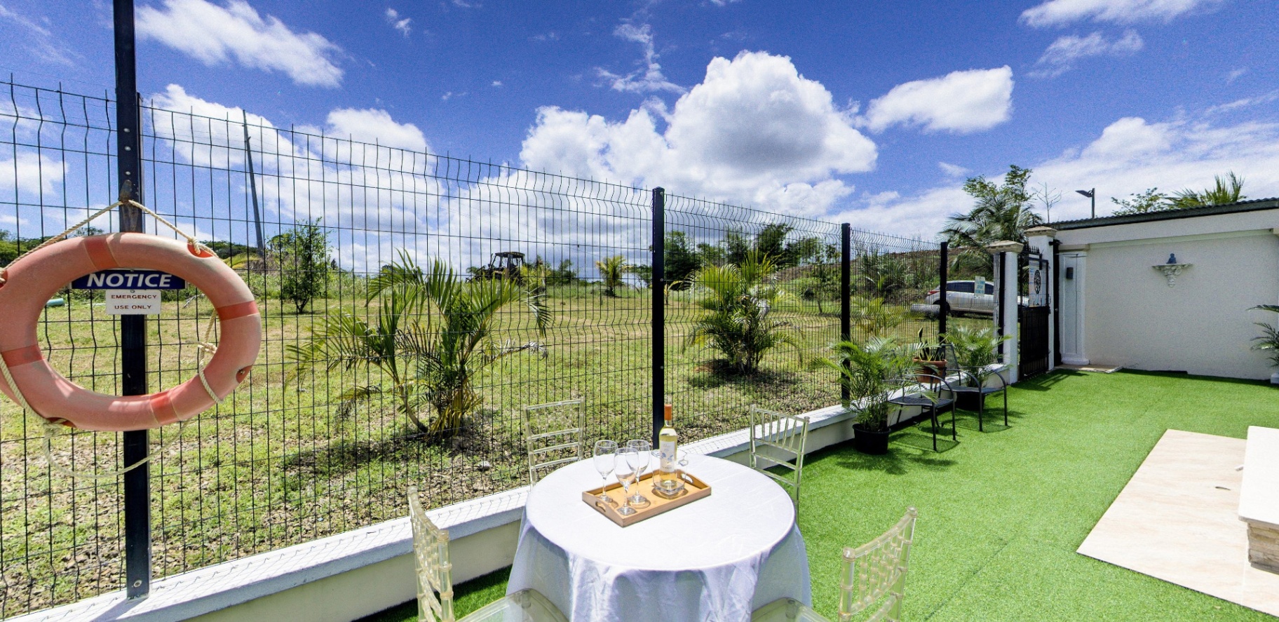 Garden dining setup with countryside view