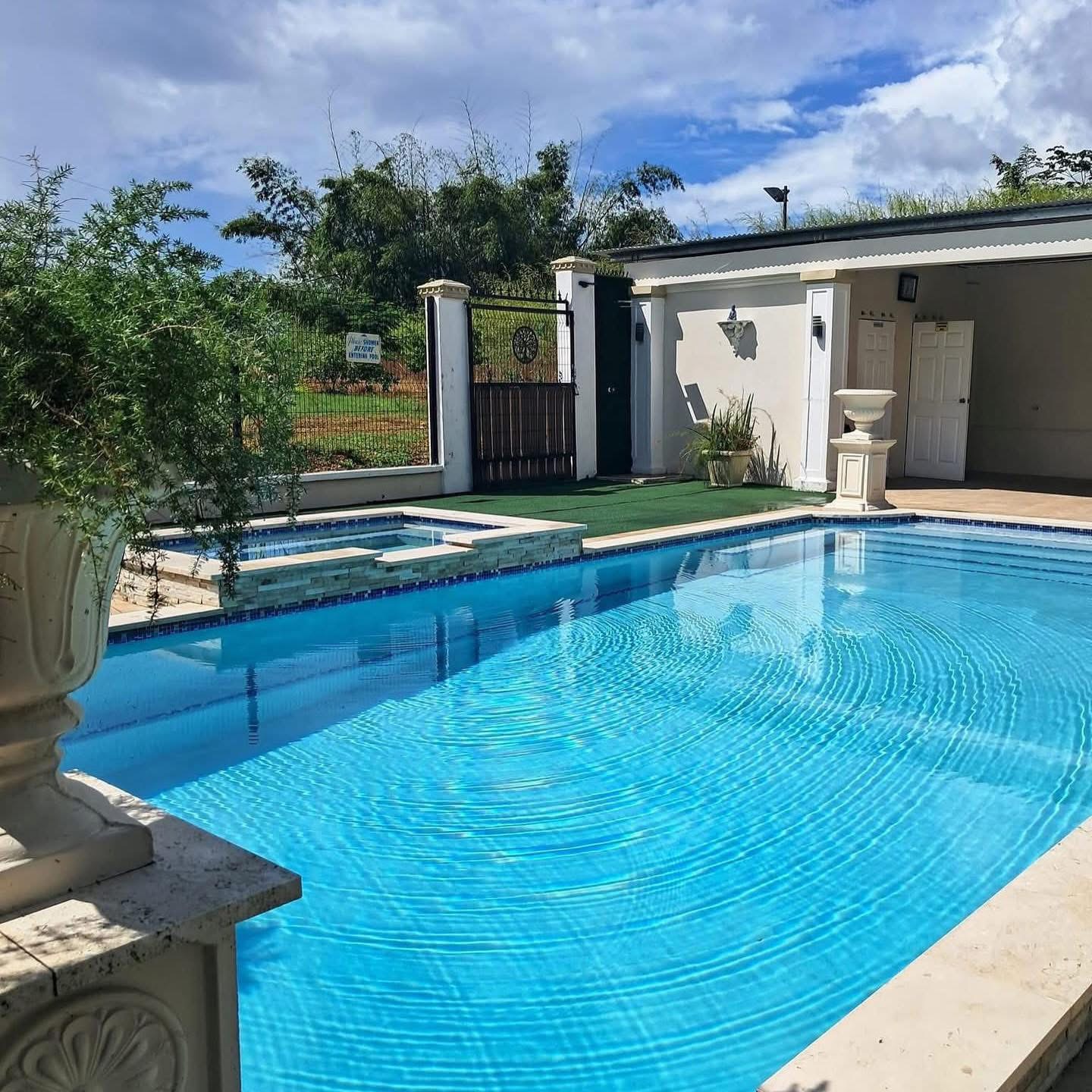Poolside pergola and lounge deck beside the villa