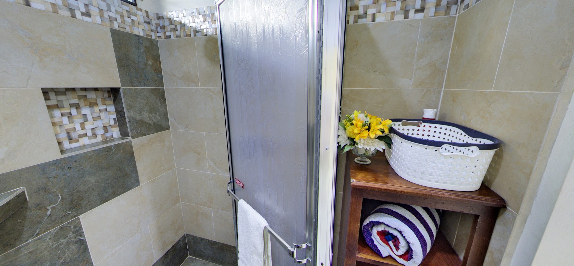 Garden suite walk-in shower with woven tile accent